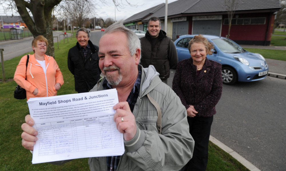 Jim McLean, with petition, is joined by, from left, his wife Lynda, Arbroath Community Councils acting chairman Sandy Bates and councillors Donald Morrison and Sheena Welsh on Mayfield Terrace.