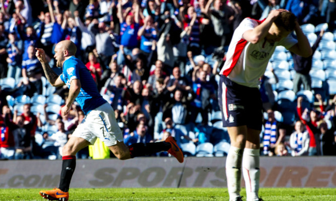 Nicky Law celebrates leveling the score late on for Rangers.