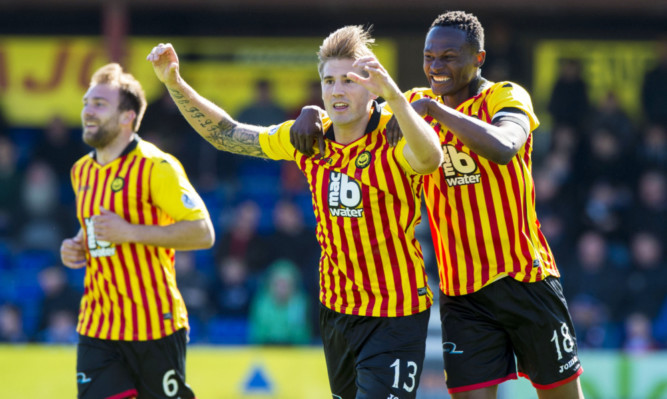 Partick Thistle's Frederic Frans celebrates scoring his goal with Abdul Osman.