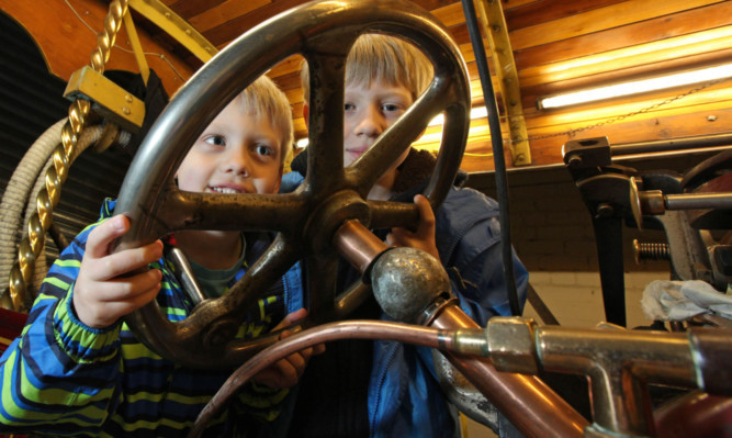 Innes and Robin Brown get 'hands-on' at the museum.