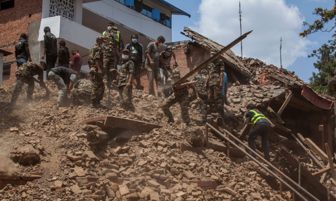 Rescuers searching collapsed buildings in Kathmandu, Nepal.