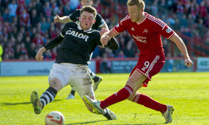John Souttar (left) tackles Aberdeen's Adam Rooney.