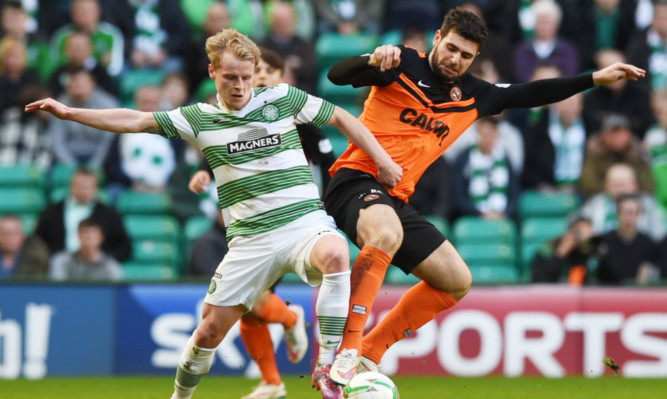 Nadir Ciftci (right) does battle with Celtic's Gary Mackay-Steven.