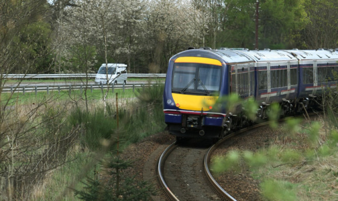 The railway line just south of Dunkeld station next to the A9.