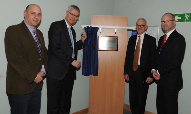 Dr Alex Baldacchino, NHS Fife director of R&D, Professor Andrew Morris, Professor David Crossman and Dr Brian Montgomery, NHS Fife interim chief executive, at the opening of the clinical research facility at Victoria Hospital, Kirkcaldy.