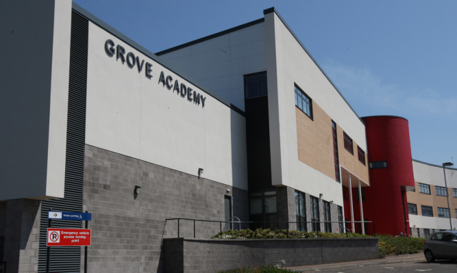 Grove Academy has been criticised for banning pupils from school on their last day.