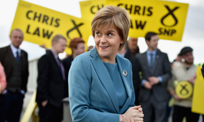 SNP leader Nicola Sturgeon's helicopter tour of Scotland continues as she visits Dundee with Chris Law candidate for Dundee West.