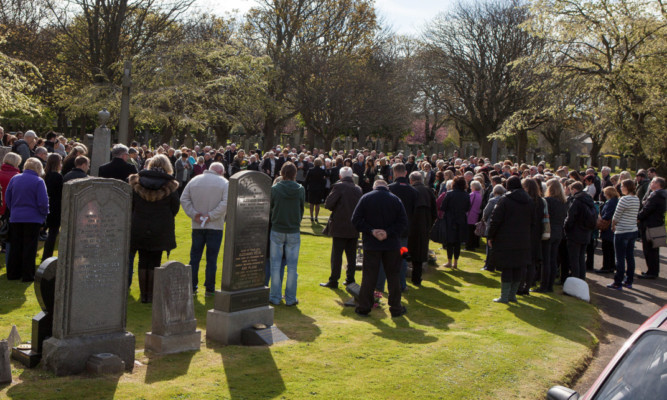 Hundreds of mourners turned out at Seafield Cemetery in Edinburgh.
