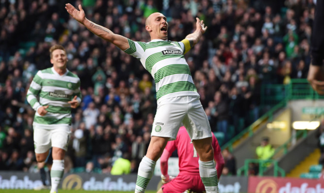 Scott Brown celebrates after making it 2-0 to Celtic.