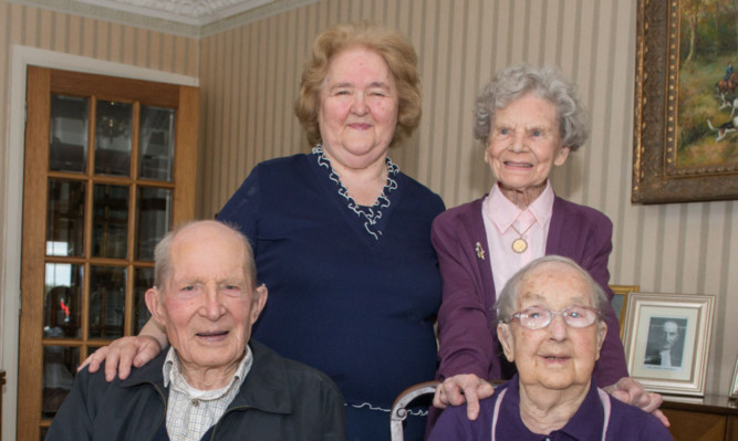 Centenarians Jessie Sinclair, back, Alf Smith and Willhelmina (Neen) Reid with host Sheena Baptie enjoying a cup of tea.