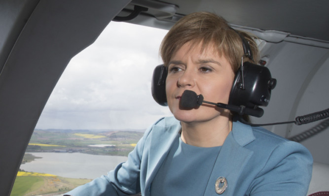 First Minister Nicola Sturgeon in a helicopter on the General Election campaign trail.