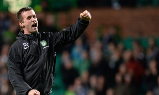 Celtic manager Ronny Deila celebrates victory in his now customary manner.