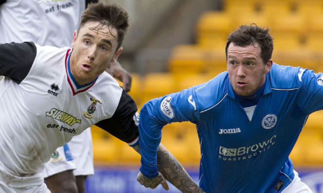 Danny Swanson battles for the ball with Greg Tansey.