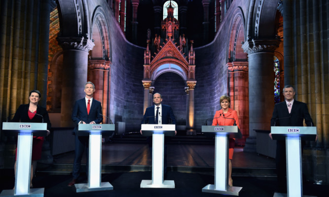 Scottish Conservative Party leader Ruth Davidson, Scottish Labour Leader Jim Murphy, presenter Glenn Campbell First Minister and leader of the SNP Nicola Sturgeon and Scottish Liberal Democrat leader Willie Rennie attend the final BBC election debate at Mansfield Traquair in Edinburgh.