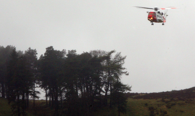 A coastguard rescue helicopter searching at the scene on Sunday.