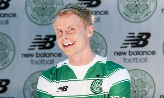Gary Mackay-Steven helping to promote his side's new home kit for next season.