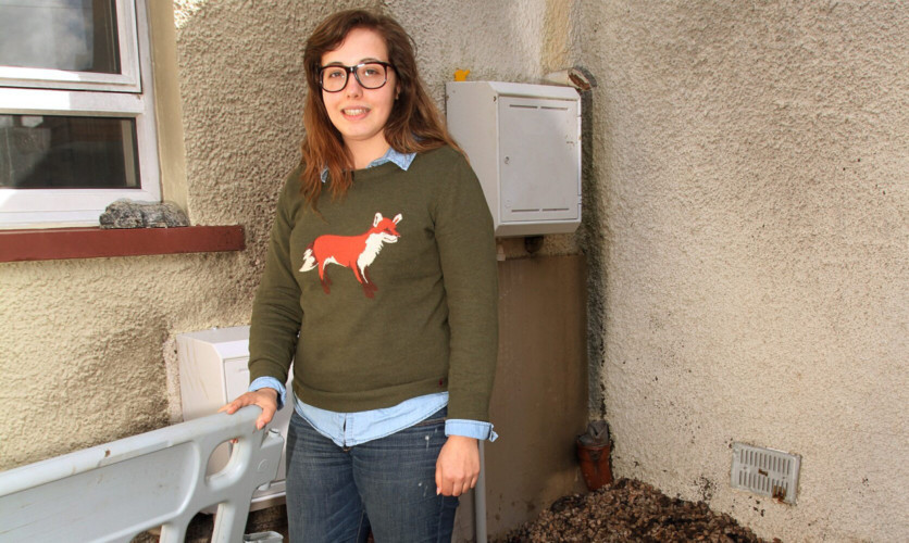 Zoe Mackie in the garden of one of the affected houses.