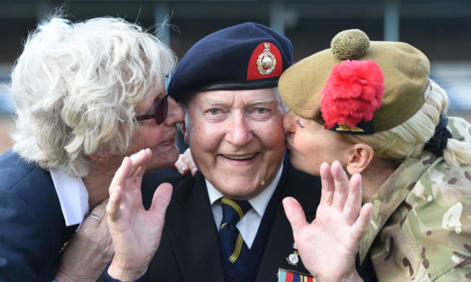 Kiss me quick! Former marine Alexander Adam, 91, and wife Barbera with Captain Margaret Brown.