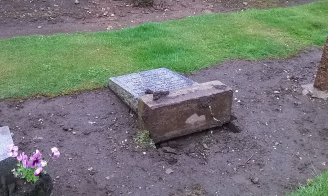 One of the toppled headstones.