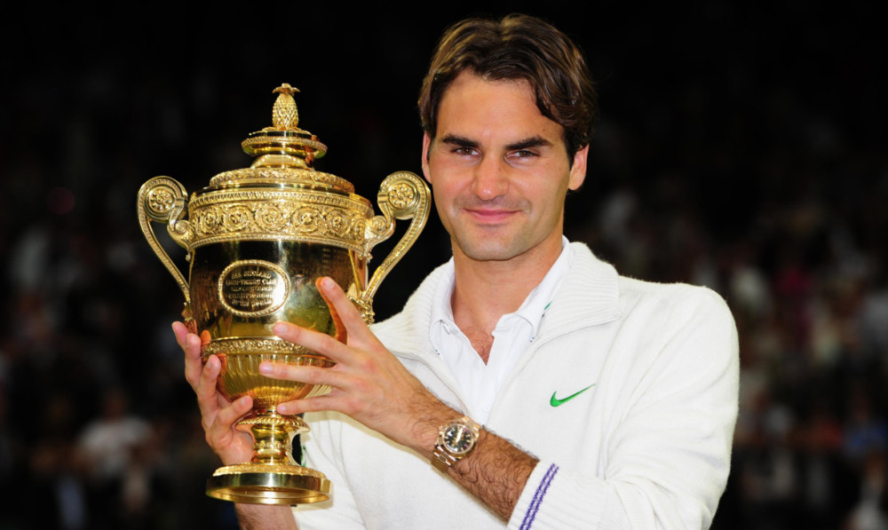 Roger Federer, lifting the mens singles title, will compete for a £1.6m prize this year.