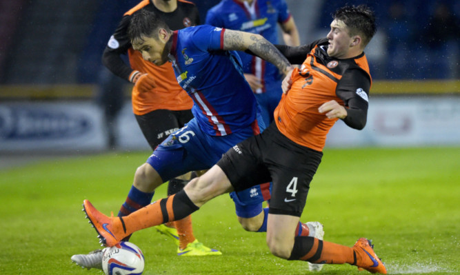 John Souttar (right) tackles Greg Tansey of ICT.