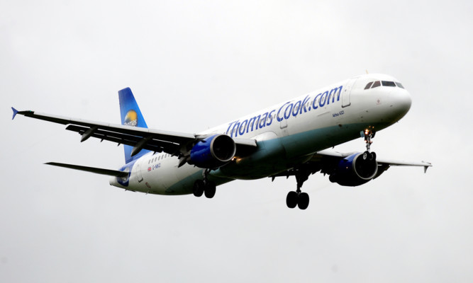 Thomas Cook plane lands at East Midlands airport.                    . PRESS ASSOCIATION Photo. Picture date: Monday July 2, 2012. See PA story. Photo credit should read: Rui Vieira/PA Wire