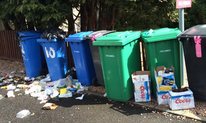 Litter left around bins on Kinnessburn Terrace has been branded 'a disgrace'.
