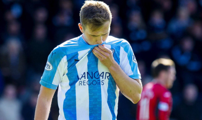 Greg Stewart walks off after red card.