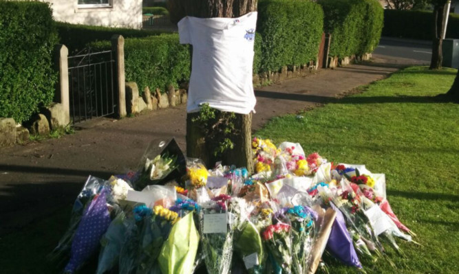 Tributes to Sheku left at the spot where he was detained by police.