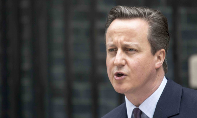 Prime Minister David Cameron speaks outside 10 Downing Street.