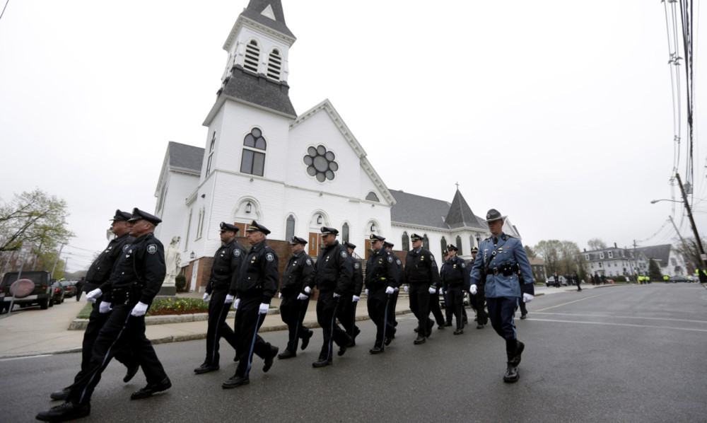 Massachusetts Institute of Technology police officers following a funeral mass for MIT police officer Sean Collier.