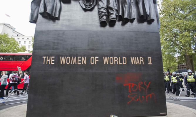 Graffiti left on The Women of World War II monument outside Downing Street.