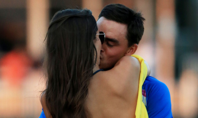 Rickie Fowler celebrates with girlfriend Alexis Randock after winning the TPC.