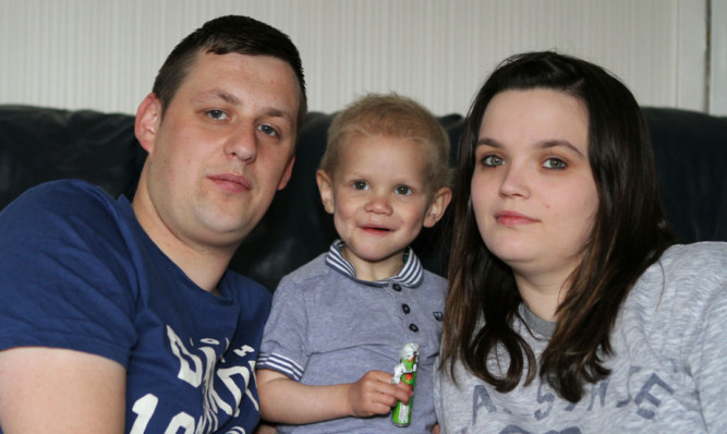 One-year-old Charlie Smith from Forfar with his dad Liam and mum Riona.