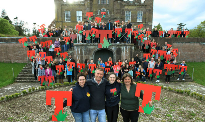 At Strathallan Castle, front from left: Debs, Jamie, Jess and Anna Roberts celebrate T in the Parks planning success with residents of the estate.