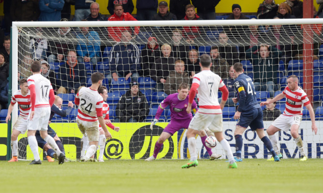 Ross County's Liam Boyce (far left) scores late on to put his side ahead.