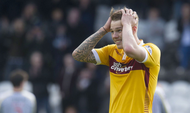 Dejection at full-time for Motherwell's Lee Erwin