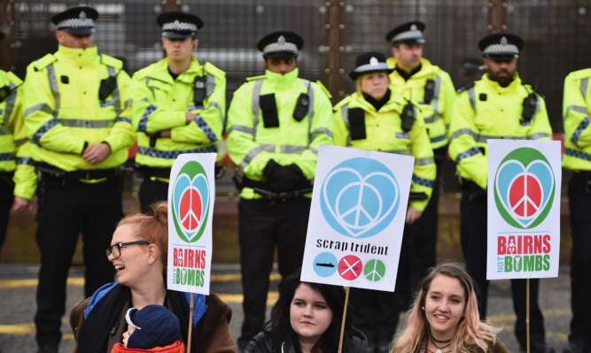 Anti-nuclear activists block one of the entrances to Faslane naval base last month.