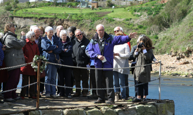 Gordon Kerr, front, with some of the people at the harbour.