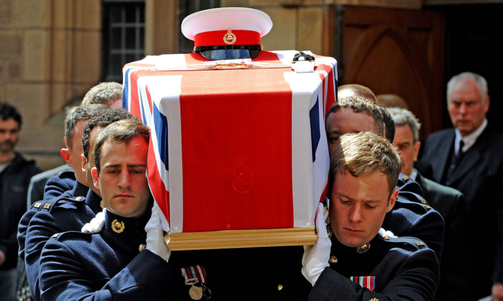 Ralph Hebden's coffin is carried from the church.