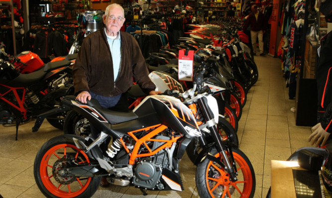 Hunter Wilson, thought to be Scotlands oldest biker, with his KTM Duke 390 at Drysdale, Perth.