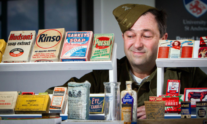 Dean Bowen from Homefront Histories shows off examples of his stock from the 1940s.