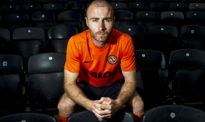 Dundee United captain Sean Dillon in the new strip after signing his deal.