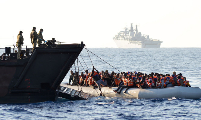 45 Commando marines rescuing migrants.