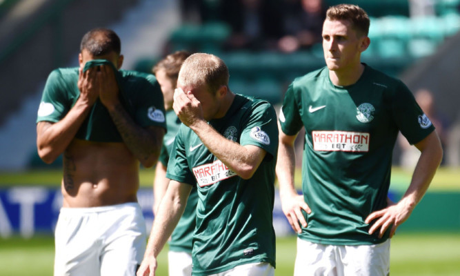 Despair for the Hibs players at full-time as they face a second season out of the top flight.