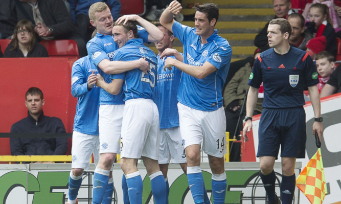 The St Johnstone players celebrate with Chris Kane.