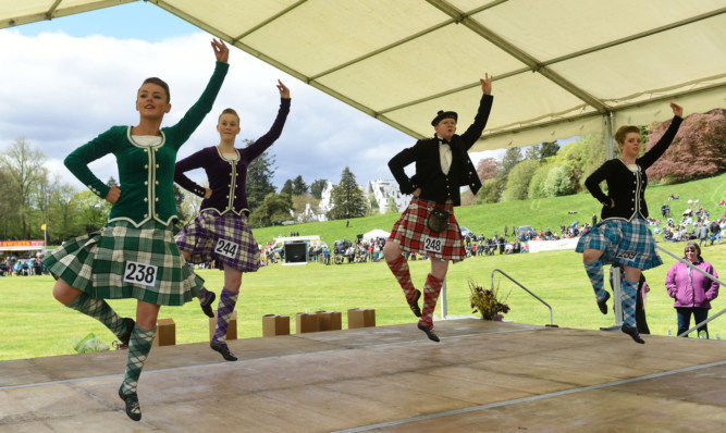 Competitors in the adult group Highland Dancing.