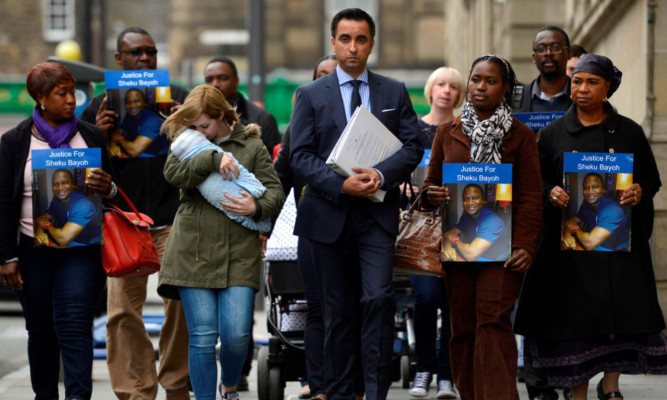 The family of Sheku Bayoh with solicitor Aamer Anwar ahead of a meeting with the Lord Advocate earlier this month.