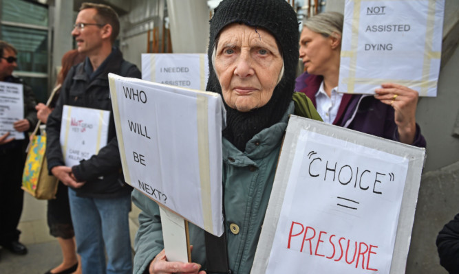 Katherine Perlo, aged 77,  campaigning outside Holyrood against the proposed legislation to allow assisted suicide. The parliament was praised for choosing life over death.