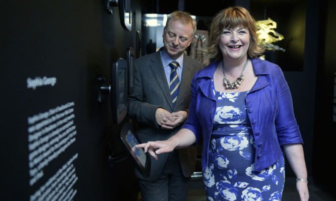 Philip Long, Director of V&A Dundee with Fiona Hyslop, Cabinet Secretary for Culture, Europe & External Affairs,  on board the V&A Dundees Design in Motion mobile exhibition.